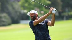Dustin Johnson holds his finish on an iron shot