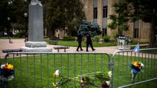 Flowers and Israeli flag outside site of Boulder attack on Jewish group