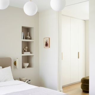 Neutral bedroom with shelving