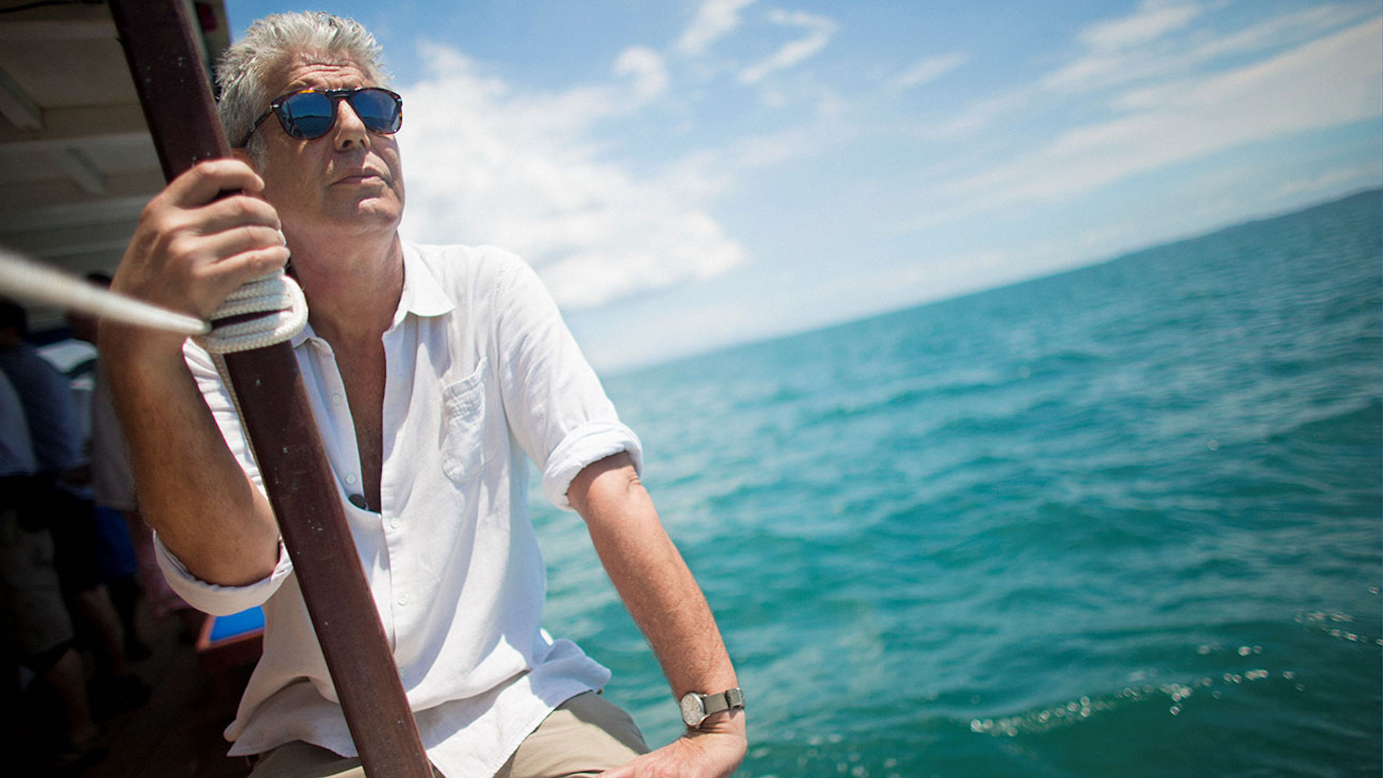 Anthony Bourdain sits on a boat in Anthony Bourdain Parts Unknown