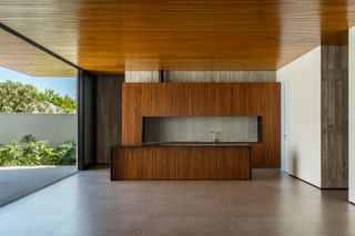 AG House by camila porto, a low brazilian house made of wood and exposed concrete