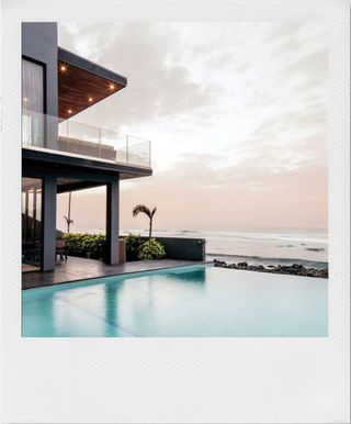 A pool and resort along the ocean