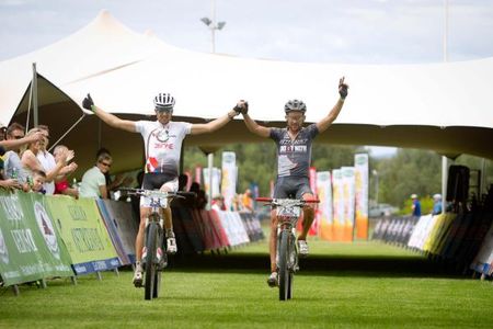 Christoph Sauser and Max Knox of 36ONE Songo.info cross the finish line to win stage 6