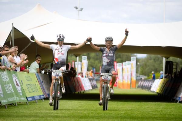 Christoph Sauser and Max Knox of 36ONE Songo.info cross the finish line to win stage 6