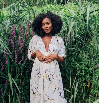 Freddie Harrel wears a curly bob