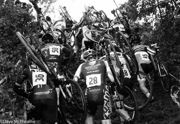 Elite men fight for position on the muddy run-up