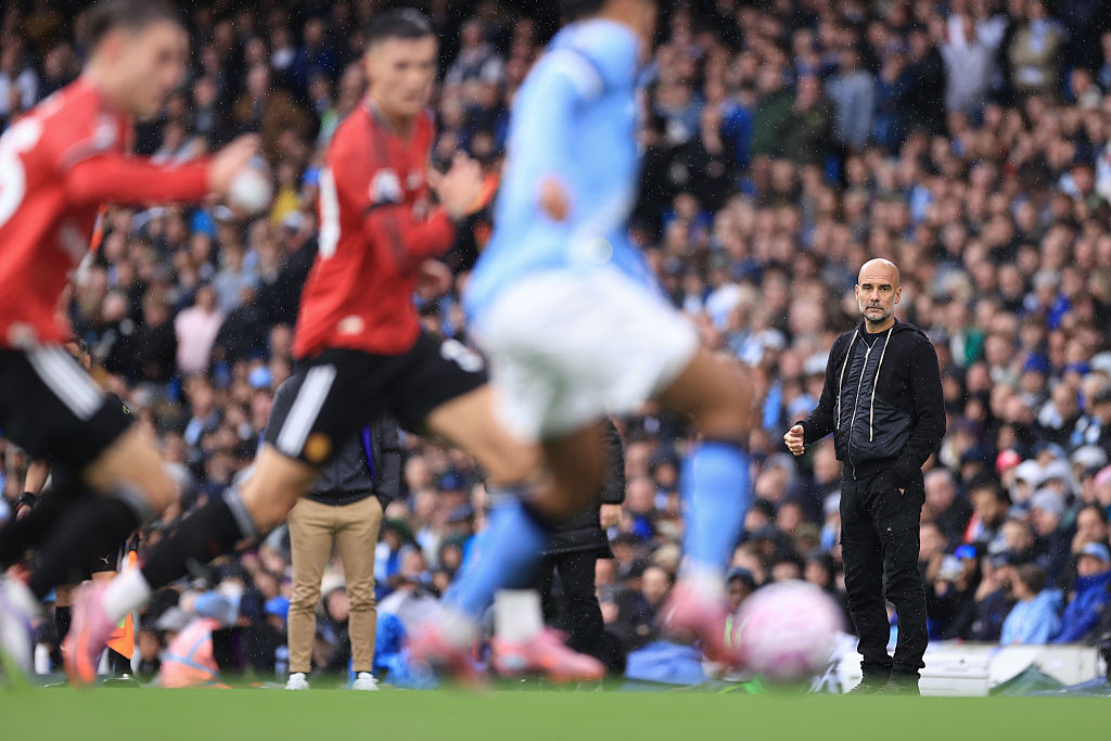 Manchester City manager Pep Guardiola looks on during the Premier League match between Manchester City and Manchester United at Etihad Stadium on September 14, 2025 in Manchester, England.