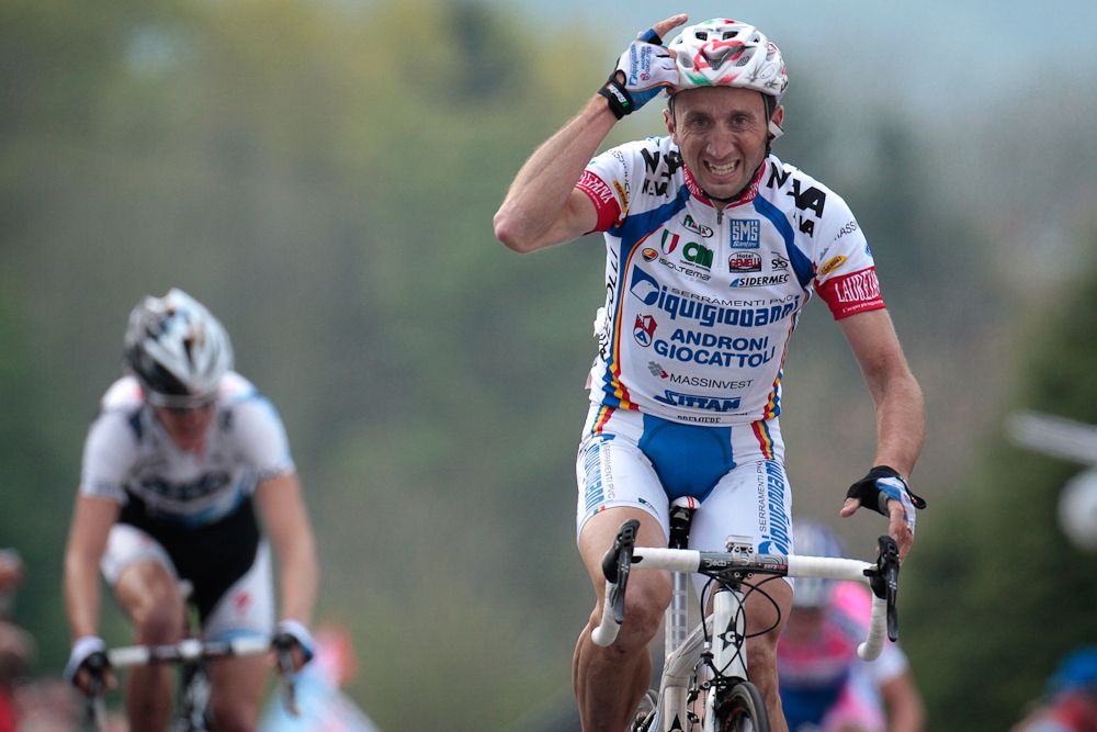 Davide Rebellin (Serramenti) celebrates as he crosses the finish line to win the Fleche Wallonne in 2009.