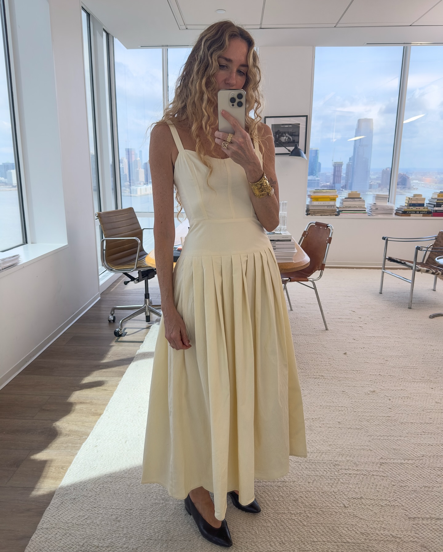 Woman in pale yellow dress.