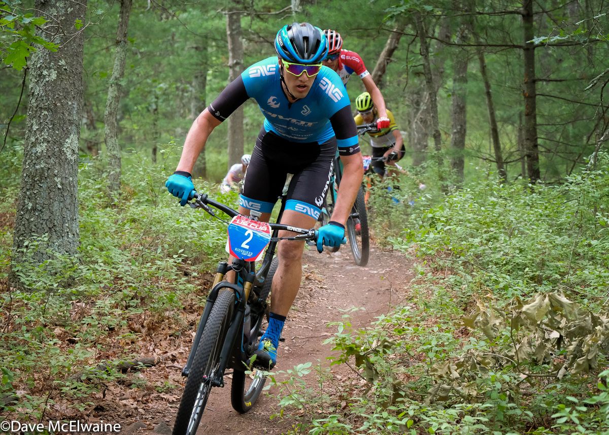 Raphael Auclair (Pivot) riding twisty singletrack during the second lap
