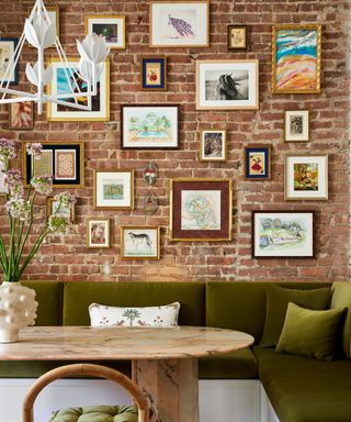 banquette seating with great cushions and exposed brick gallery wall