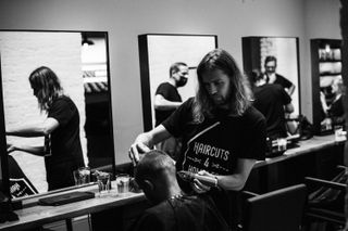 Leigh Keates cutting haircuts at Haircuts4Homeless