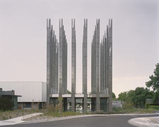 The slim tall concrete columns of Pezo von Ellrichshausen Molonglo's 'LESS' pavilion