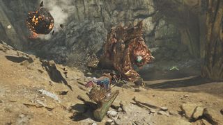 An Ajarakan hurls an explosive boulder at a hunter in Monster Hunter Wilds.