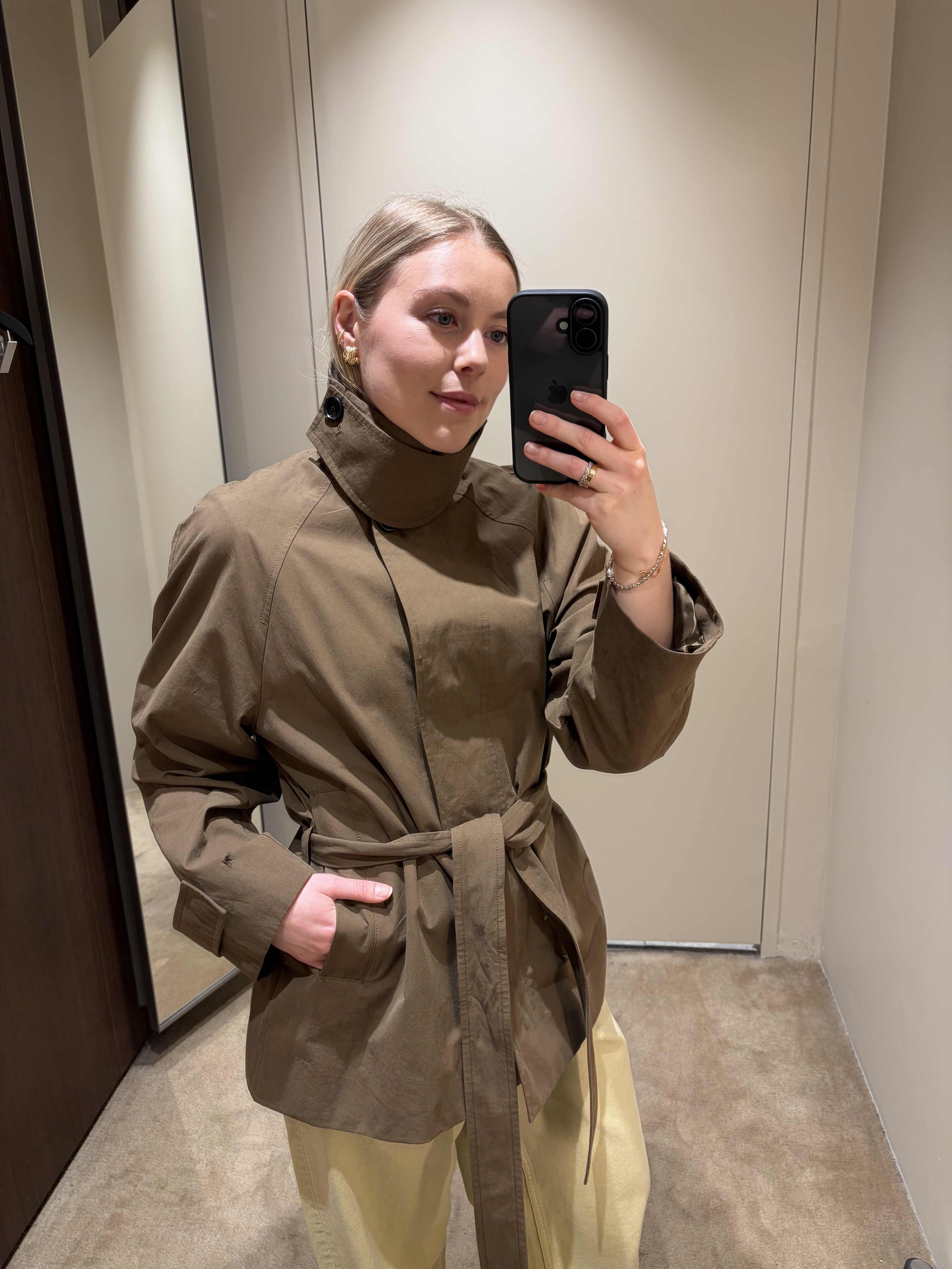 Woman wears trench coat