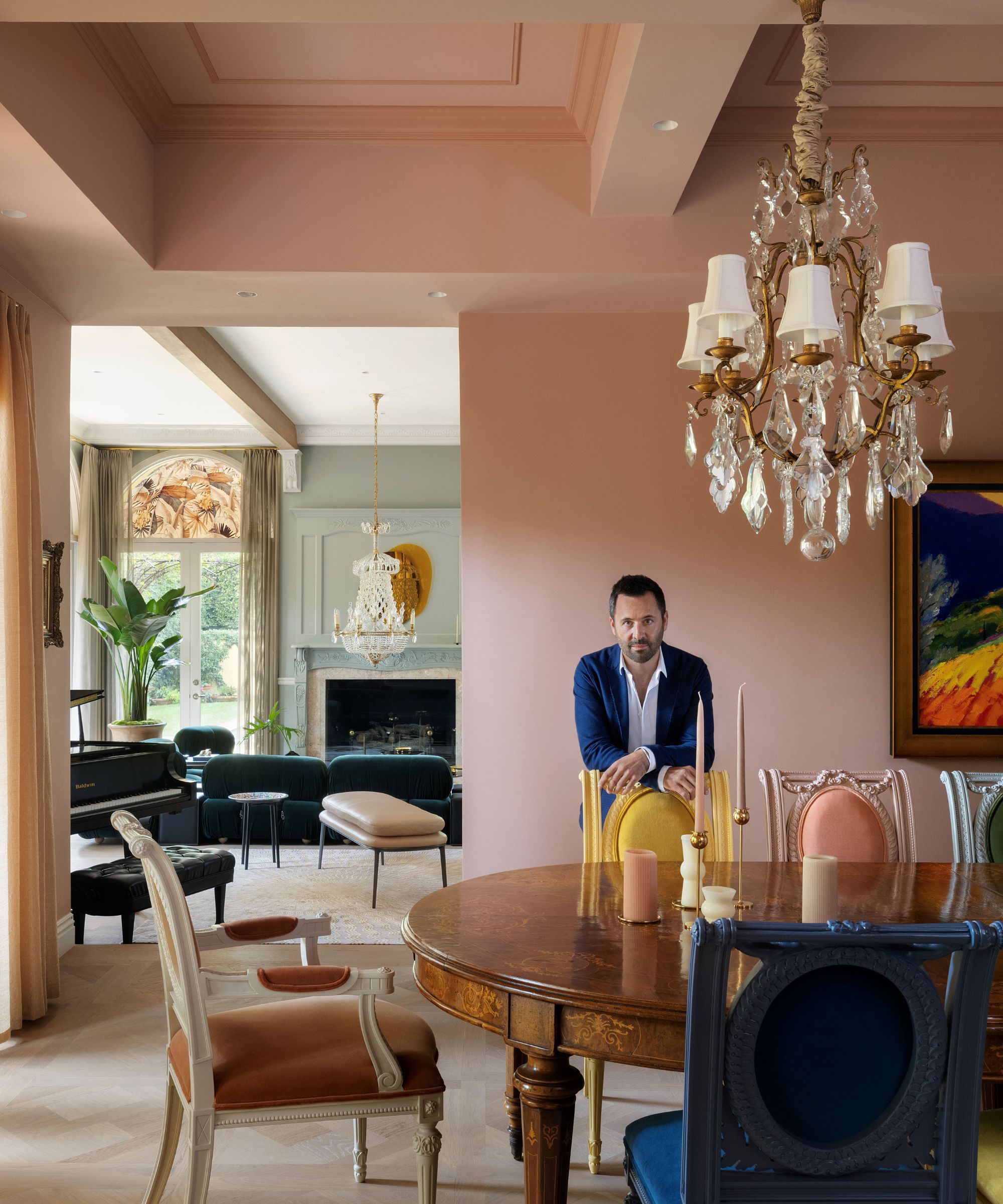 Designer Tancred Vilucchi in an LA dining room with pink walls