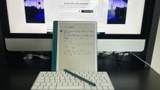 The Amazon Kindle Scribe tablet and stylus on a desk