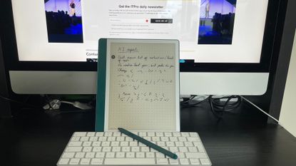 The Amazon Kindle Scribe tablet and stylus on a desk 