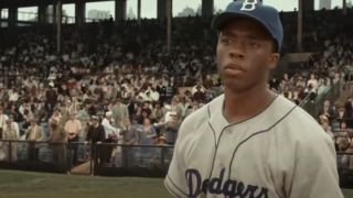Chadwick Boseman as Jackie Robinson in 42