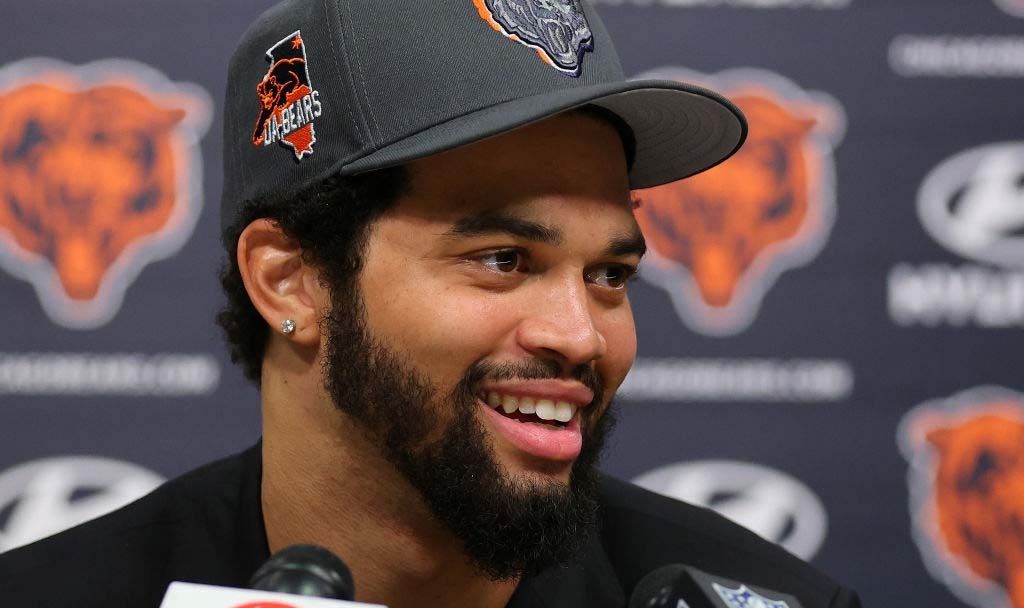 Caleb Williams #18 of the Chicago Bears speaks answers a question from the media during his introductory press conference at Halas Hall on April 26, 2024