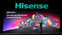 A Hisense executive presenting the new Hisense RGB Mini LED range on a stage at CES 2026