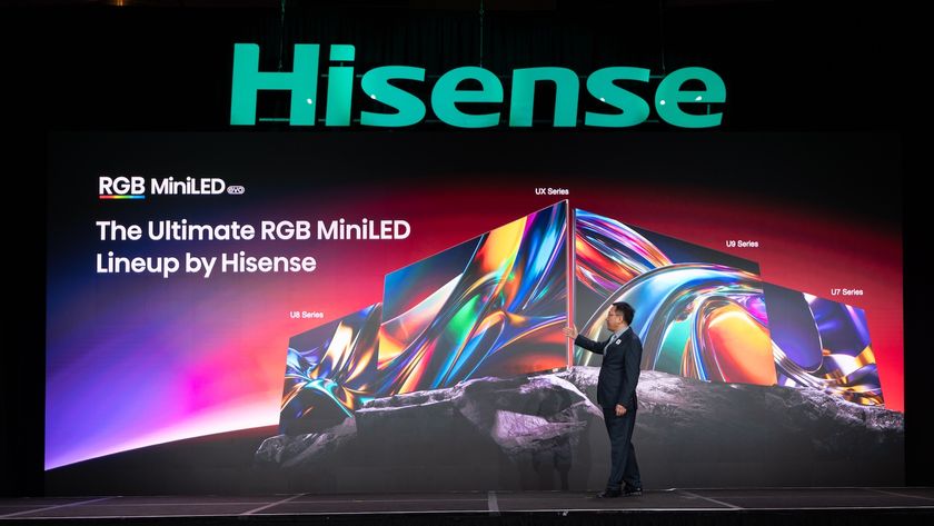 A Hisense executive presenting the new Hisense RGB Mini LED range on a stage at CES 2026