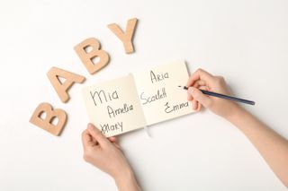 Baby names written on a list