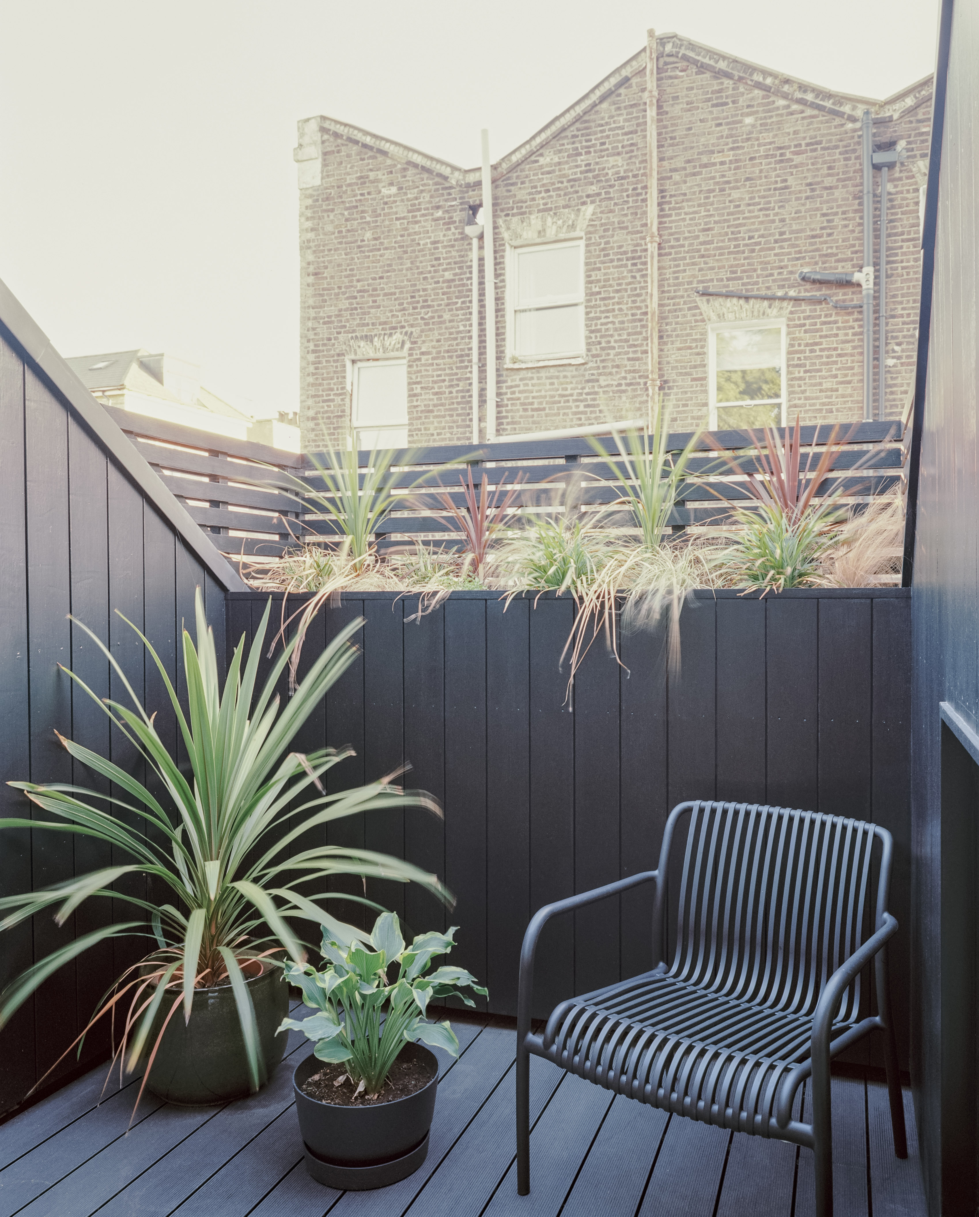 The first floor balcony provides essential outdoor space