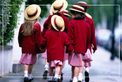 Group of girls in private school uniform, including hats, walking to school