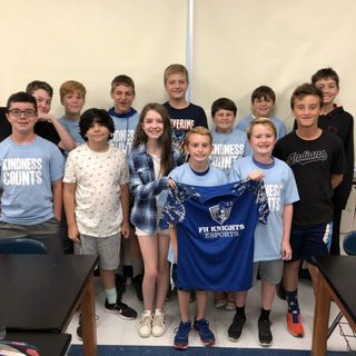 Kids pose with FH Knights team jersey