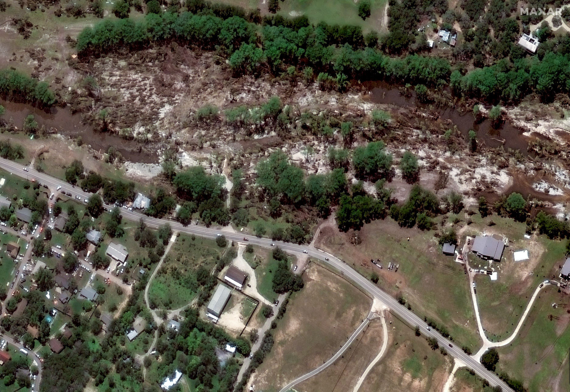 A satellite photograph of fallen trees beside the Guadalupe River on July 8, after the flooding.