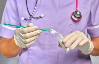 HPV symptoms in women: Nurse/doctor doing Smear Test