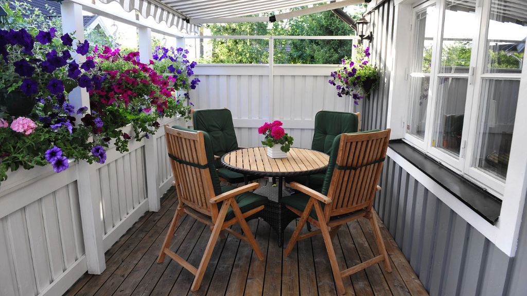 A table and chairs on a porch