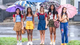 (left to right) Maia Reficco, Zaria, Bailee Madison, Chandler Kinney, Malia Pyles stand while holding umbrellas in Pretty Little Liars: Summer School
