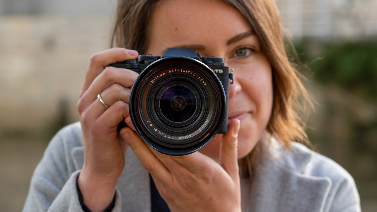 Woman using Fujifilm X-T5 with XF 16-35mm f/2.8 zoom lens