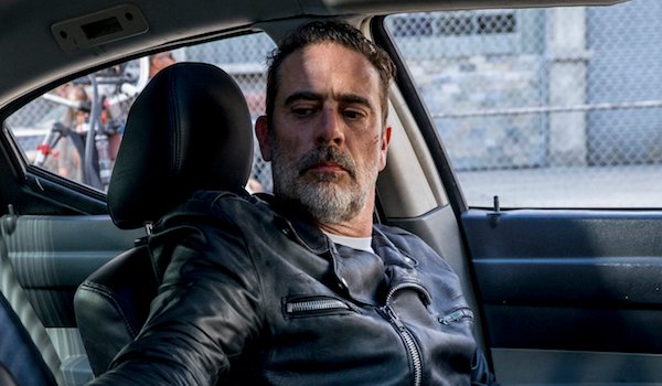 negan holding bat in guts the walking dead