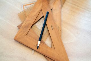 wooden squares with pencil