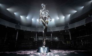 Metal female body sculpture with lights