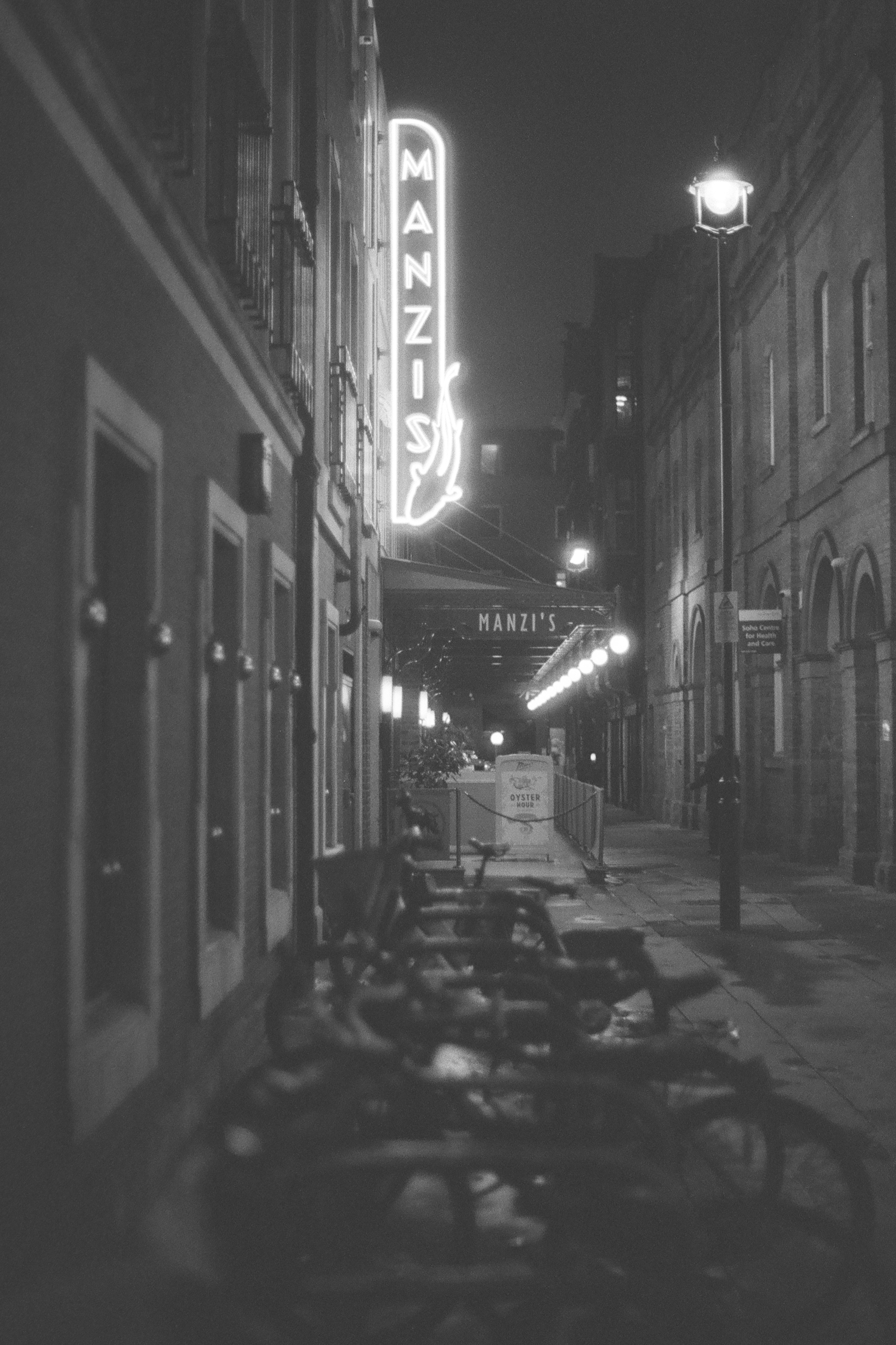Sample photo of AgfaPhoto APX 400 35mm film showing night-time scene outside Manzis in London&#039;s Soho