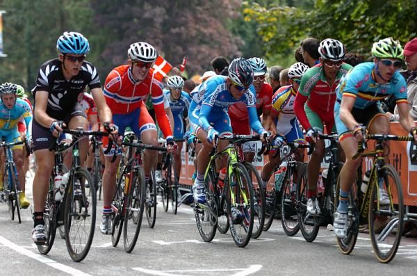 Riders show the strain of climbing the Cauberg.