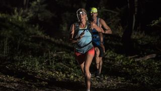 two runners with a head torch