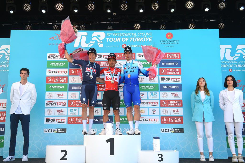 KUSADASI TURKEY APRIL 10 LR Jasper Philipsen of Belgium and Team AlpecinFenix on second place stage winner Caleb Ewan of Australia and Team Lotto Soudal and Kaden Groves of Australia and Team Bikeexchange Jayco on third place pose on the podium ceremony after the 57th Presidential Cycling Tour Of Turkey 2021 Stage 1 a 202km stage from Bodrum to Kuadas TUR2022 on April 10 2022 in Kusadasi Turkey Photo by Dario BelingheriGetty Images