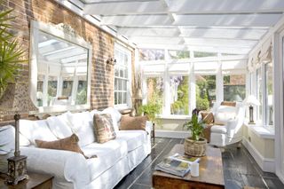 conservatory with exposed brick wall in sitting room