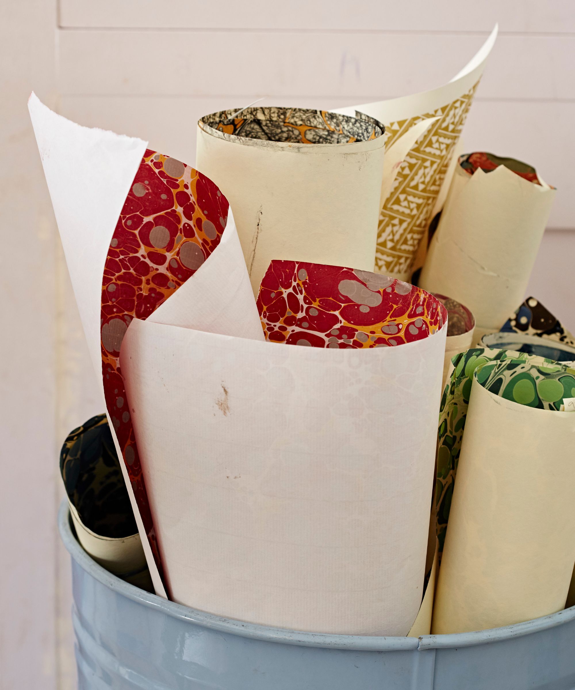 Marbled rolls of paper in a container