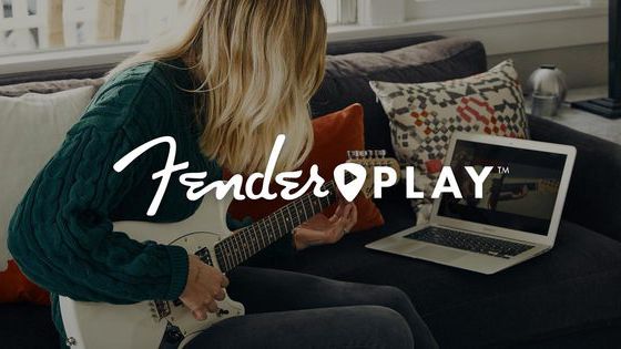 Fender Play logo laid over the top of a woman playing guitar