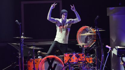  Travis Barker performs onstage during the Bud Light Super Bowl Music Festival at Crypto.com Arena on February 10, 2022 in Los Angeles, California.