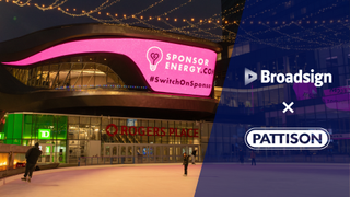 The Broadsign and PATTISON logo alongside a lit u sports arena.