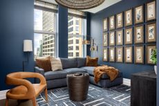 Navy blue living room with rust accents