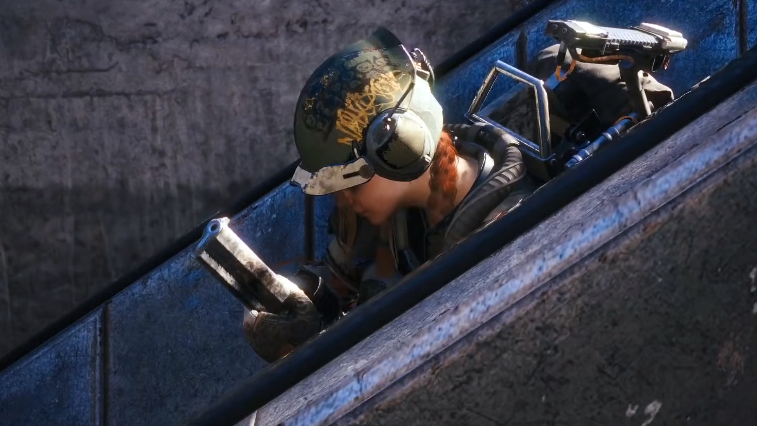 Arc Raiders: A player wearing a green helmet reloading an Anvil while crouched on an escalator.