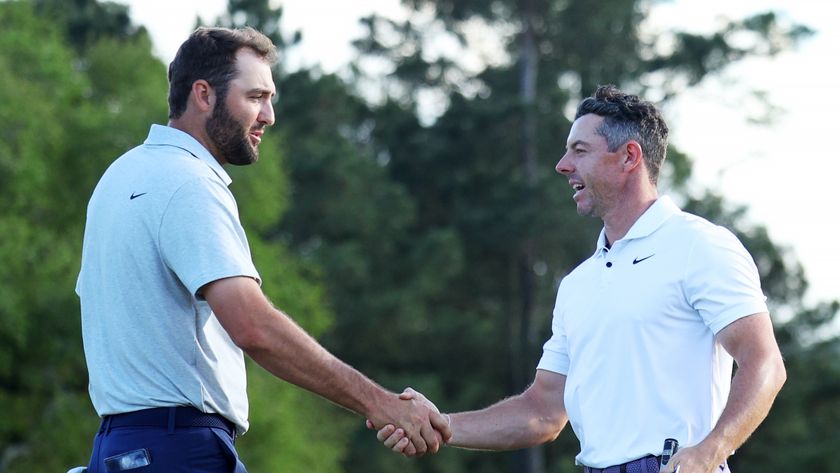 Scottie Scheffler of the United States and Rory McIlroy of Northern Ireland shaking hands. 